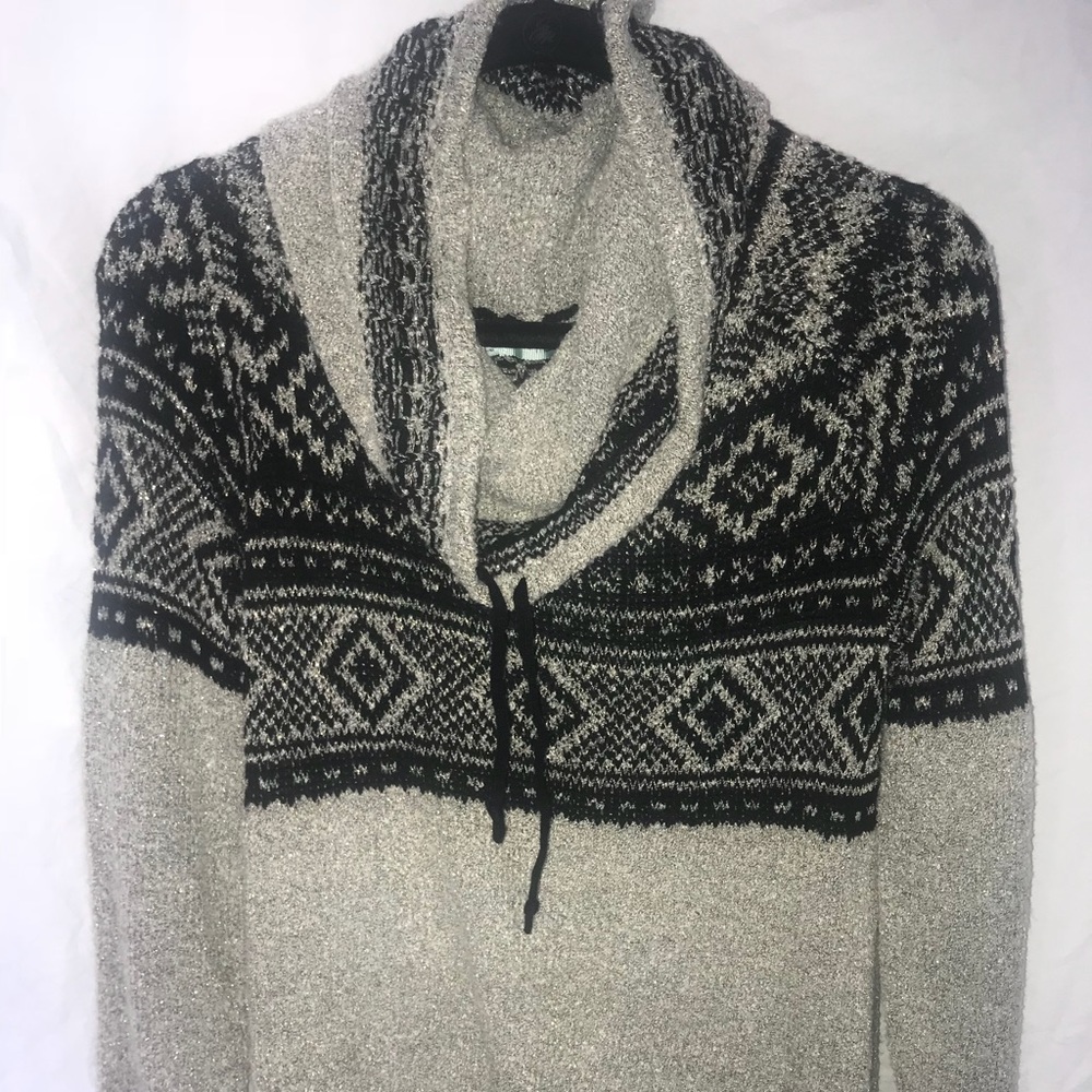 Maurice’s black and grey sweater with cowl neck